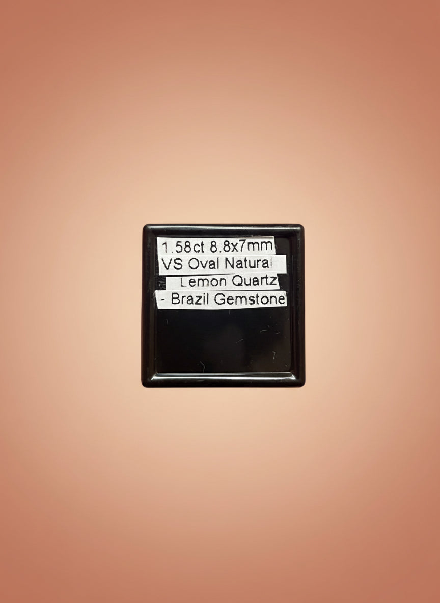 Small black rectangular object held in a hand with text on it