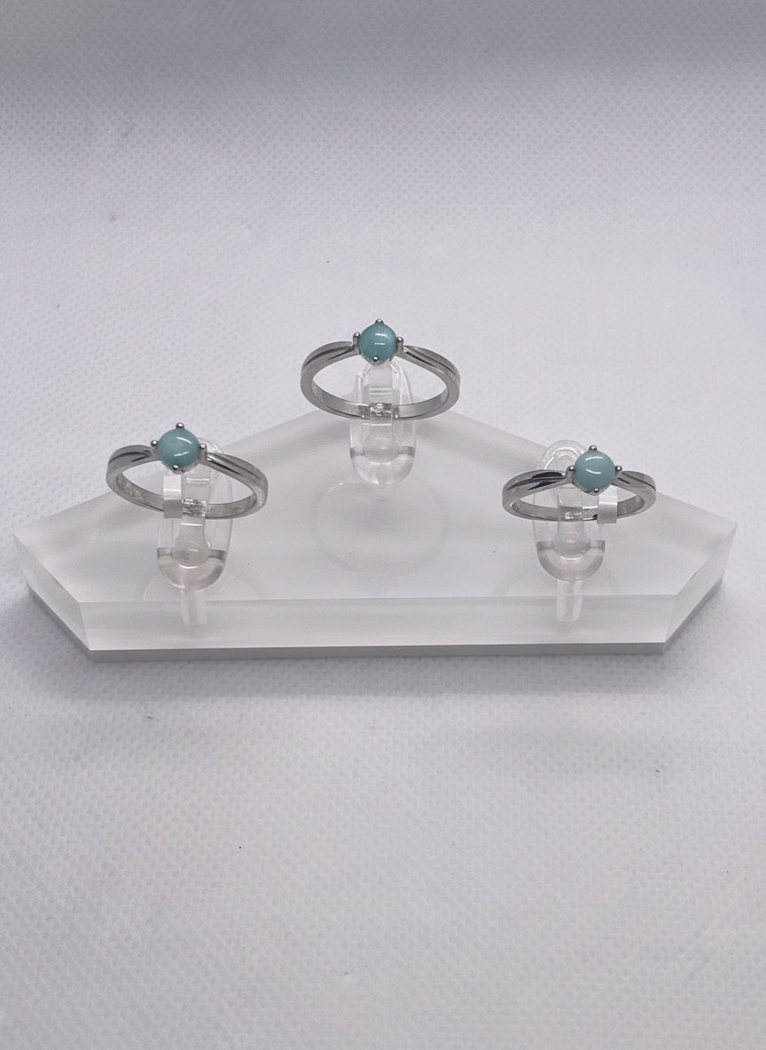 three rings on a clear holder 