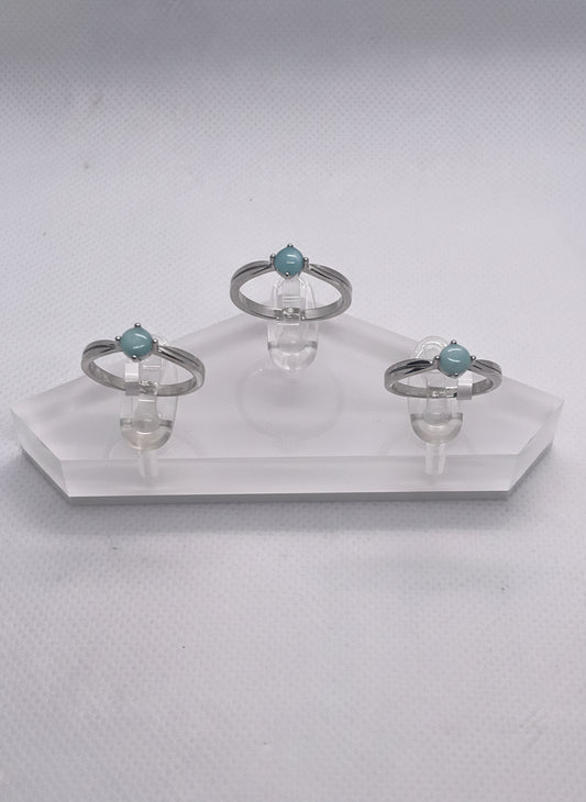 three rings on a clear holder 