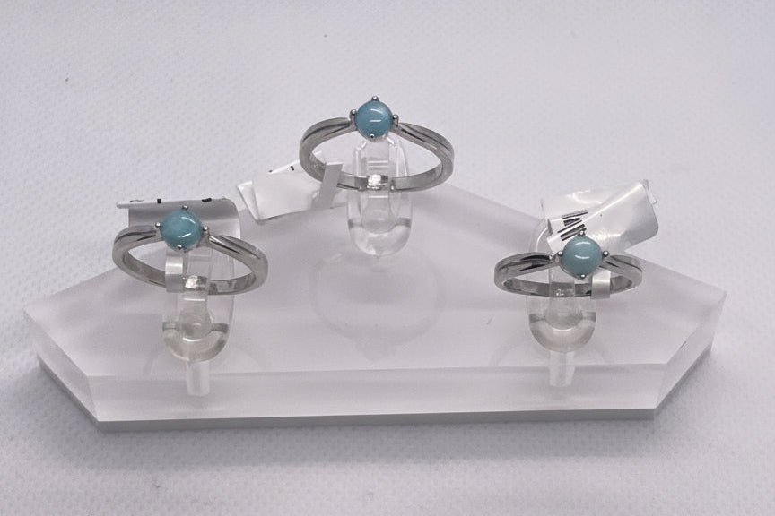 three rings on a clear holder 